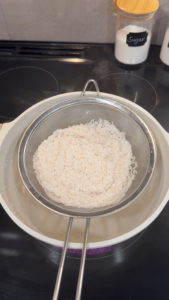 Sticky Rice in Mesh Sieve Over a Pot of Water