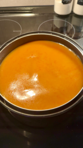 Malatang broth in nabe hot pot bowl on stovetop