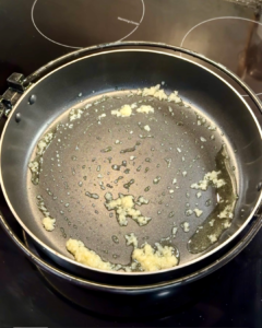 close up shot of sauteed garlic in pan