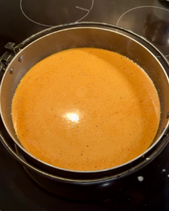 Close up shot of rose tteokbokki sauce in pan