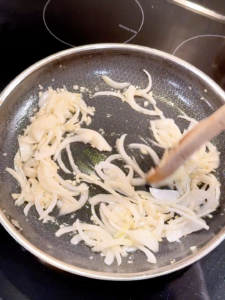 Stir fried onions in pan